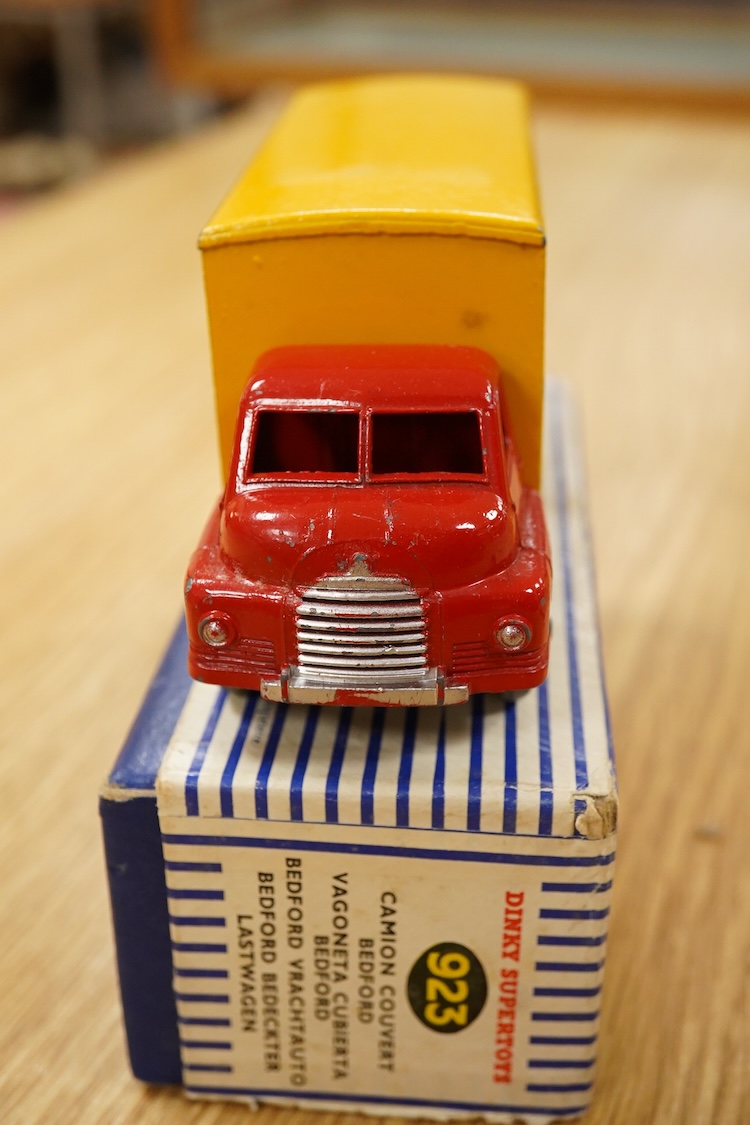 Nine Dinky Toys; Big Bedford Heinz van (923), Austin Atlantic Convertible (106), Austin-Healey 100 (109), M.G. Midget (108), Cunningham C-5R (133), Motocart (342), Austin Champ (674), Army Covered Wagon (623), and Army 1